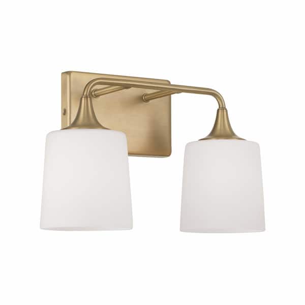 slide 2 of 13, Presley 2-light Bath/ Vanity Fixture w/ Soft White Glass Aged Brass