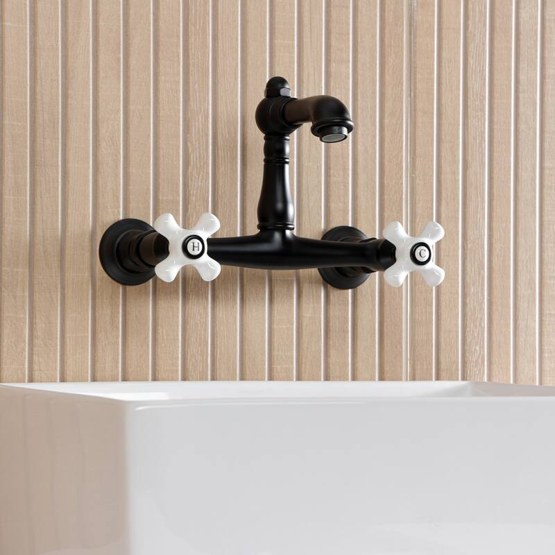 Kingston Brass English Country Two-Handle 2-Hole Wall Mount Bathroom Faucet