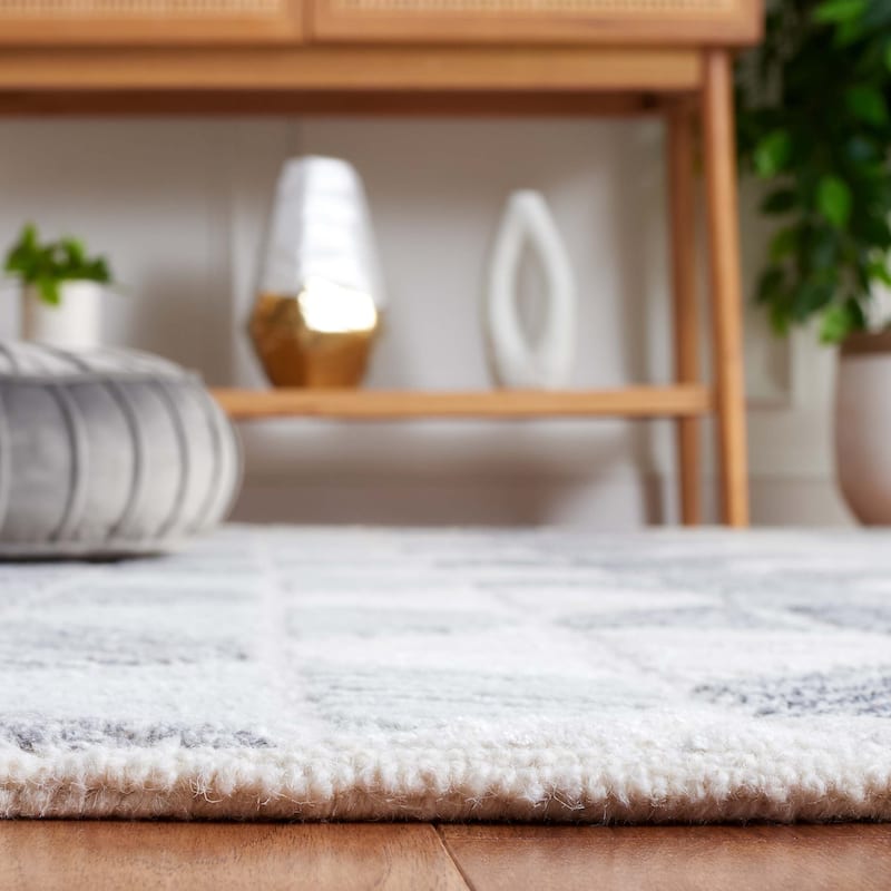 SAFAVIEH Handmade Ebony Sidonie Modern Wool Rug