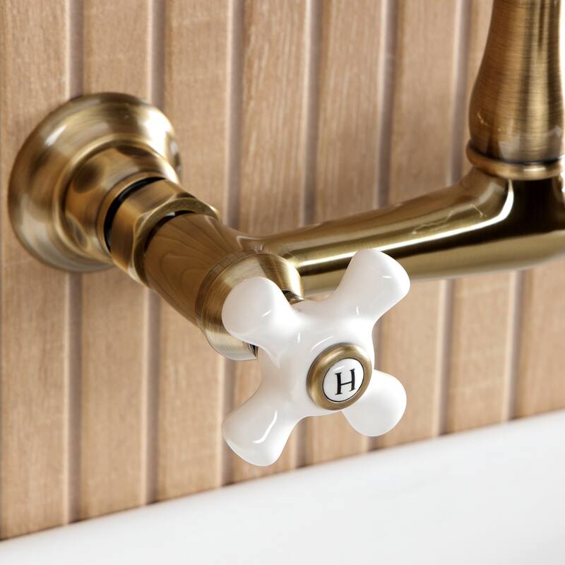 Kingston Brass English Country Two-Handle 2-Hole Wall Mount Bathroom Faucet