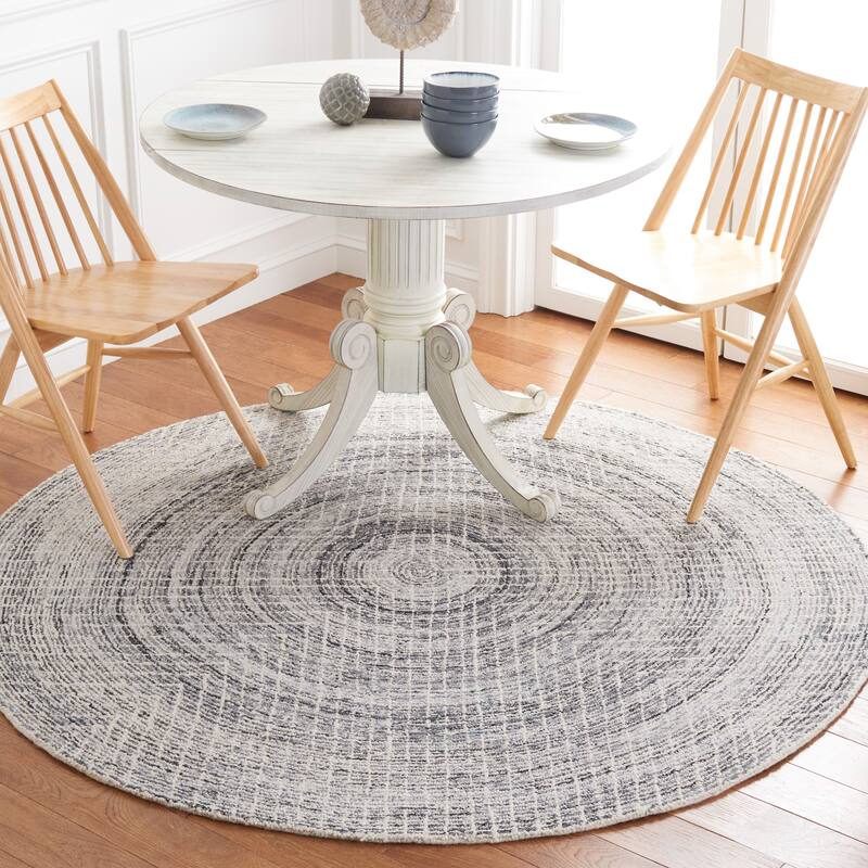 SAFAVIEH Handmade Abstract Cemile Modern Wool Rug - 6' Round - Black/Ivory - Round
