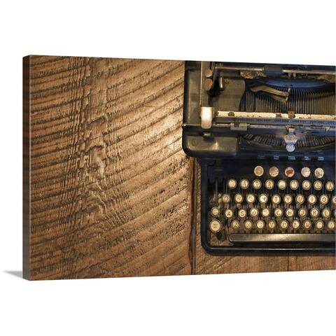 "Antique typewriter on wooden surface" Canvas Wall Art