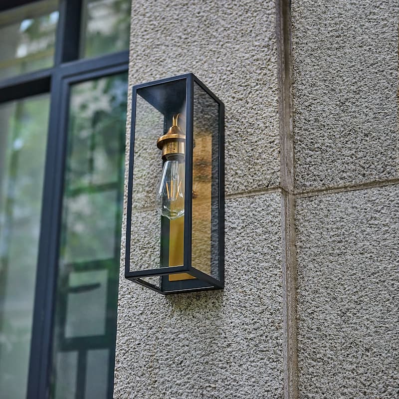 1 Light outdoor wall sconce with clear glass, Black exterior , gold interior Finish - 14"H x 4.75"W x 5.5"D