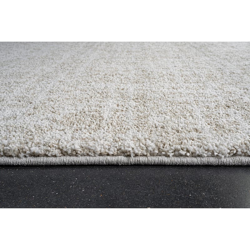Matilda Ivory and Beige Polypropylene Area Rug - 9' x 12'