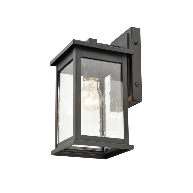 Millennium Lighting Bowton 1 Light Outdoor Wall Sconce in Powder Coat Black with Clear Glass Shade