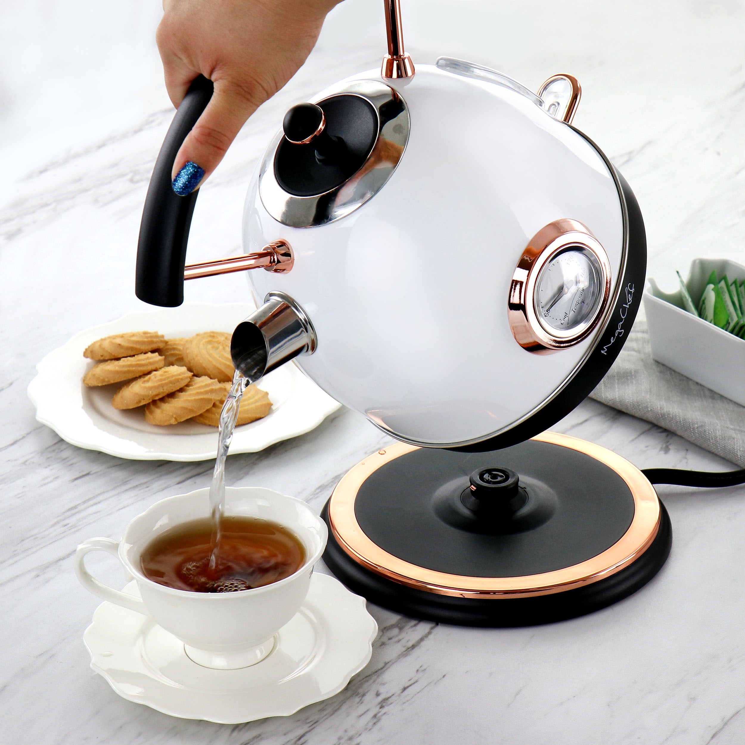 https://ak1.ostkcdn.com/images/products/is/images/direct/034ace3f94d41ac9490b52f3446c6da51b35e3a0/MegaChef-1.8L-Half-Circle-Electric-Tea-Kettle-with-Thermostat-in-White.jpg