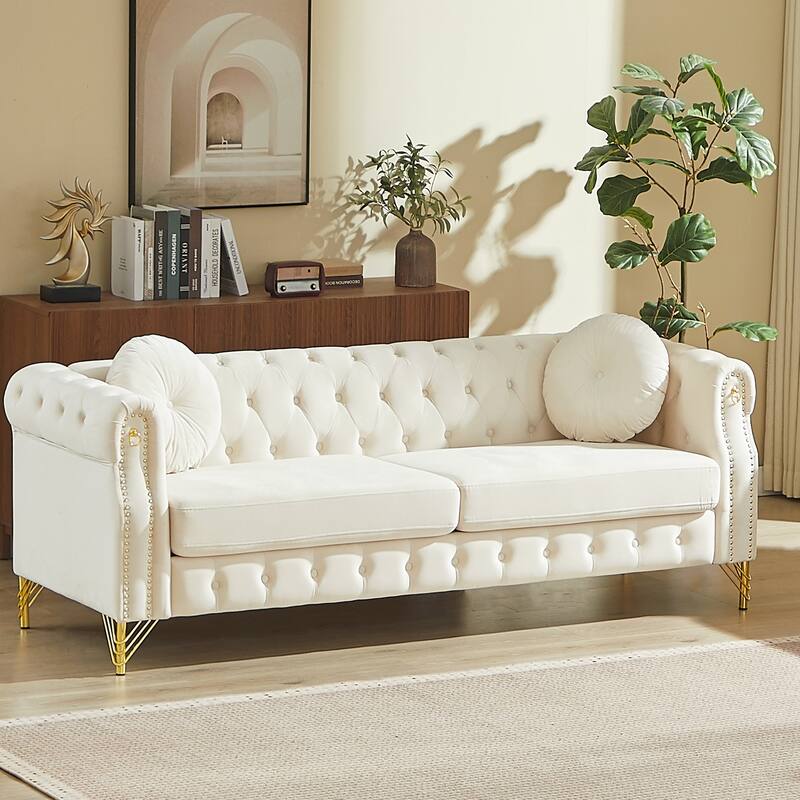 Chesterfield Sofa with Two Round Pillows, Featuring Copper Stud Detailing and Tufted Button Accents