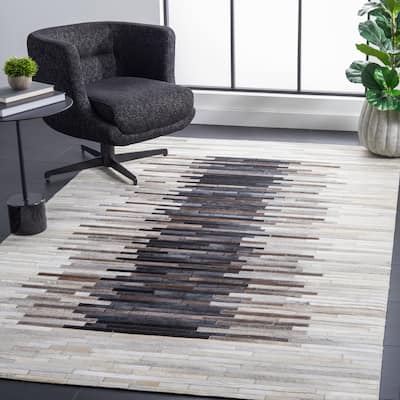 SAFAVIEH Handmade Studio Leather Klodeta Mid-Century Modern Rug