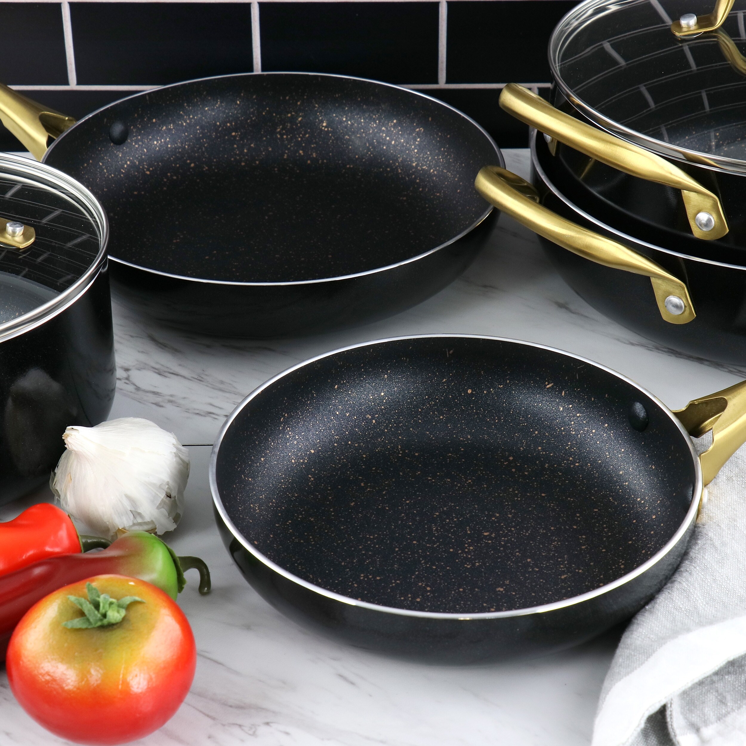 https://ak1.ostkcdn.com/images/products/is/images/direct/03a7d5cb4aee0a74fce74a9ad88f8e0093823241/Gibson-Home-Ellsworth-12-Piece-Aluminum-Nonstick-Cookware-Set.jpg