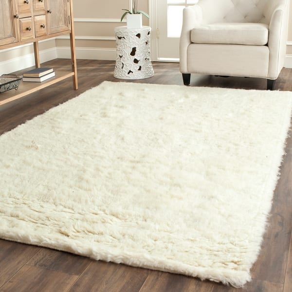 slide 1 of 16, SAFAVIEH Handmade Flokati Tonda Shag Solid Wool Rug 3' x 5' - Ivory