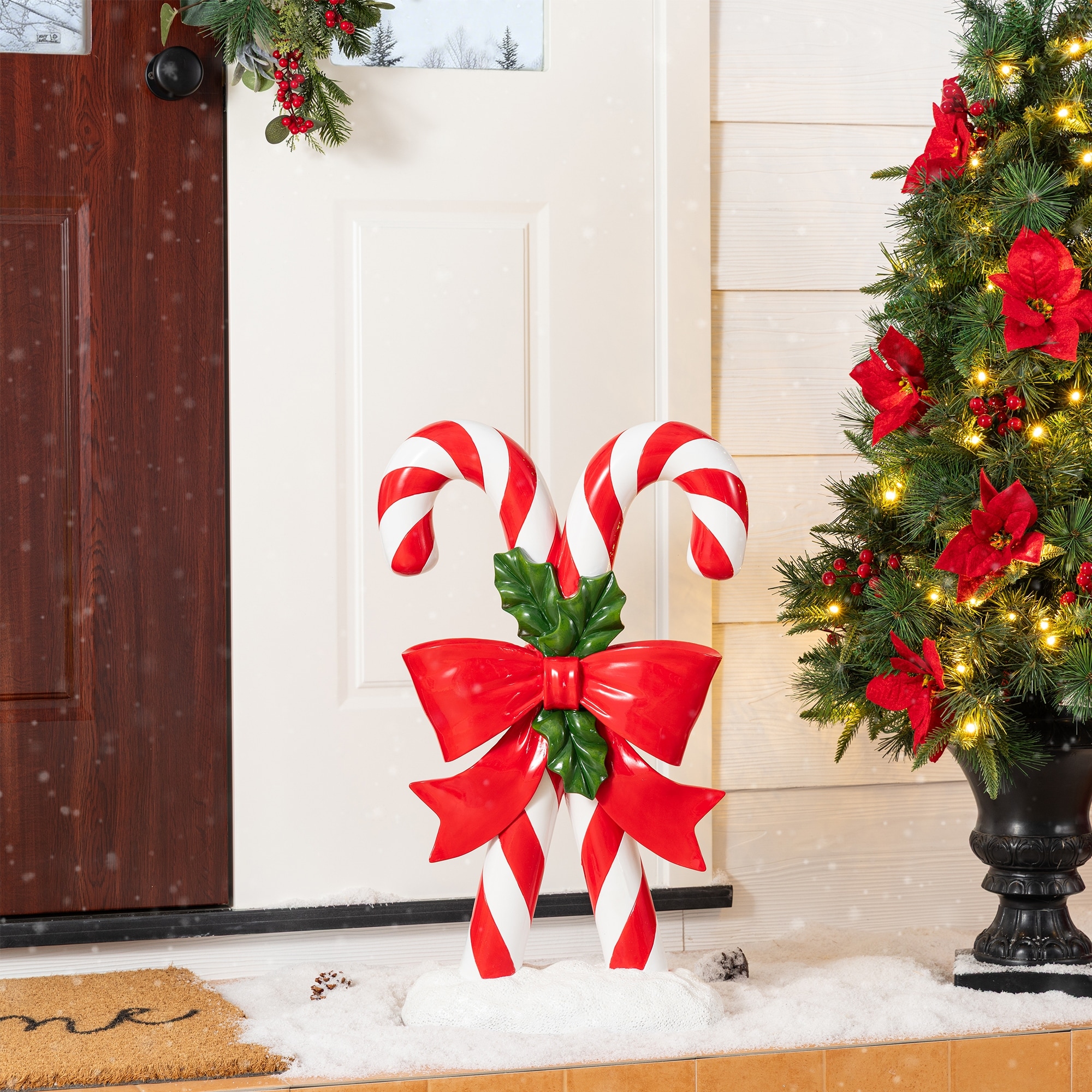 Glitzhome 24"H Christmas Polyresin Candy Cane Porch Decor