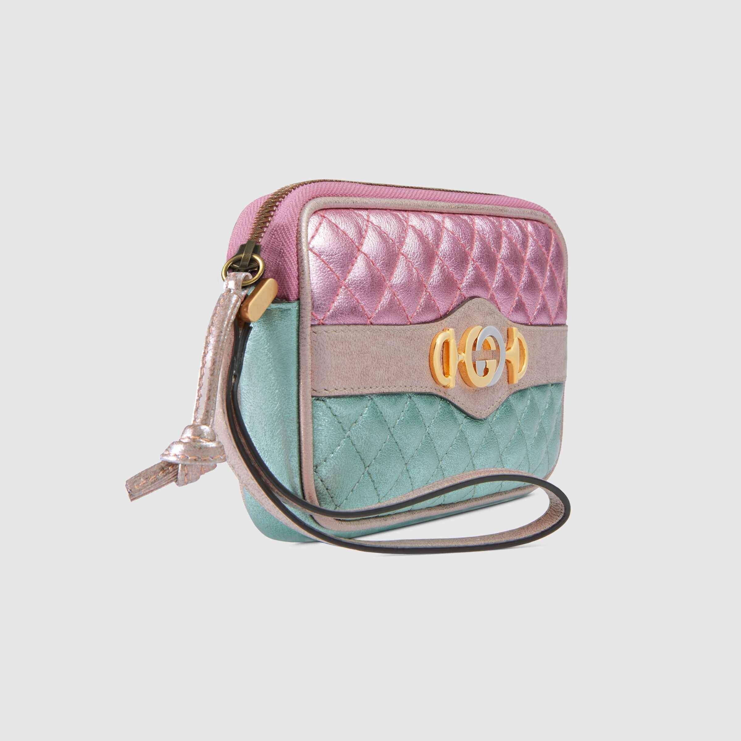 pink and blue clutch bag
