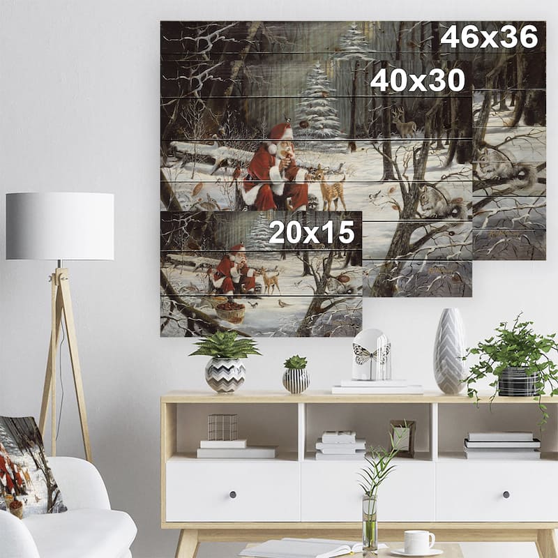 Designart 'Santa Claus with deer in snowy woods' Print on Natural Pine Wood - White