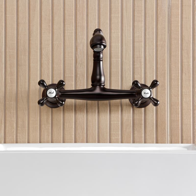 Kingston Brass English Country Two-Handle 2-Hole Wall Mount Bathroom Faucet