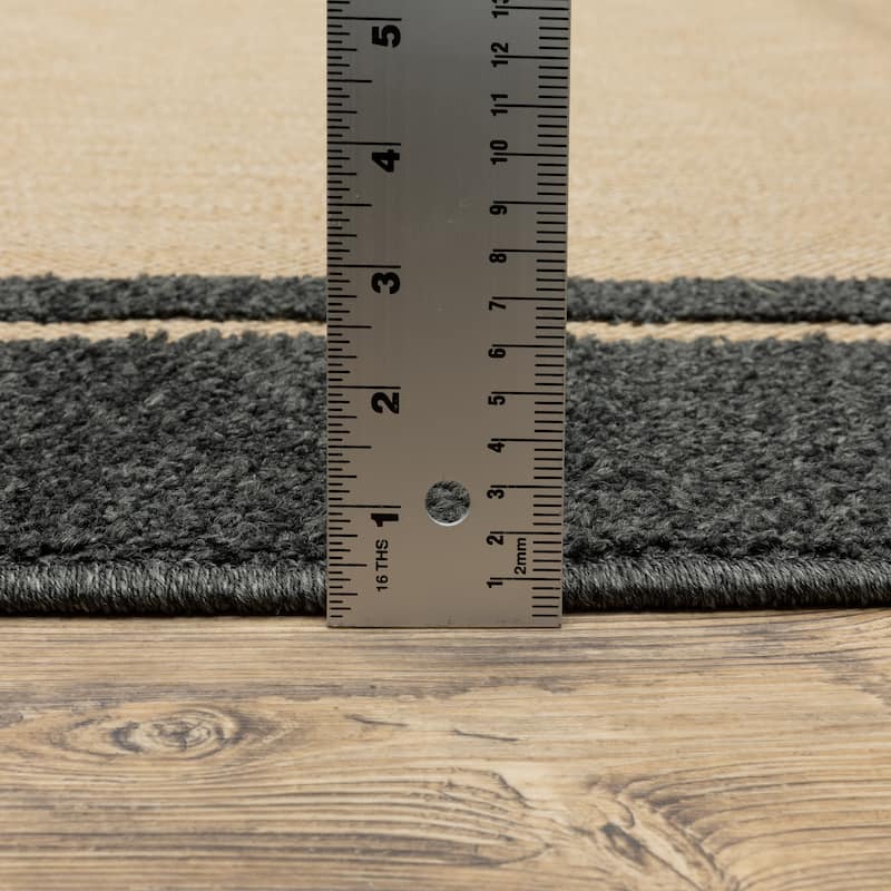 Vista Home Capri Mixed Pile Bordered Black/Tan Indoor-Outdoor Area Rug.