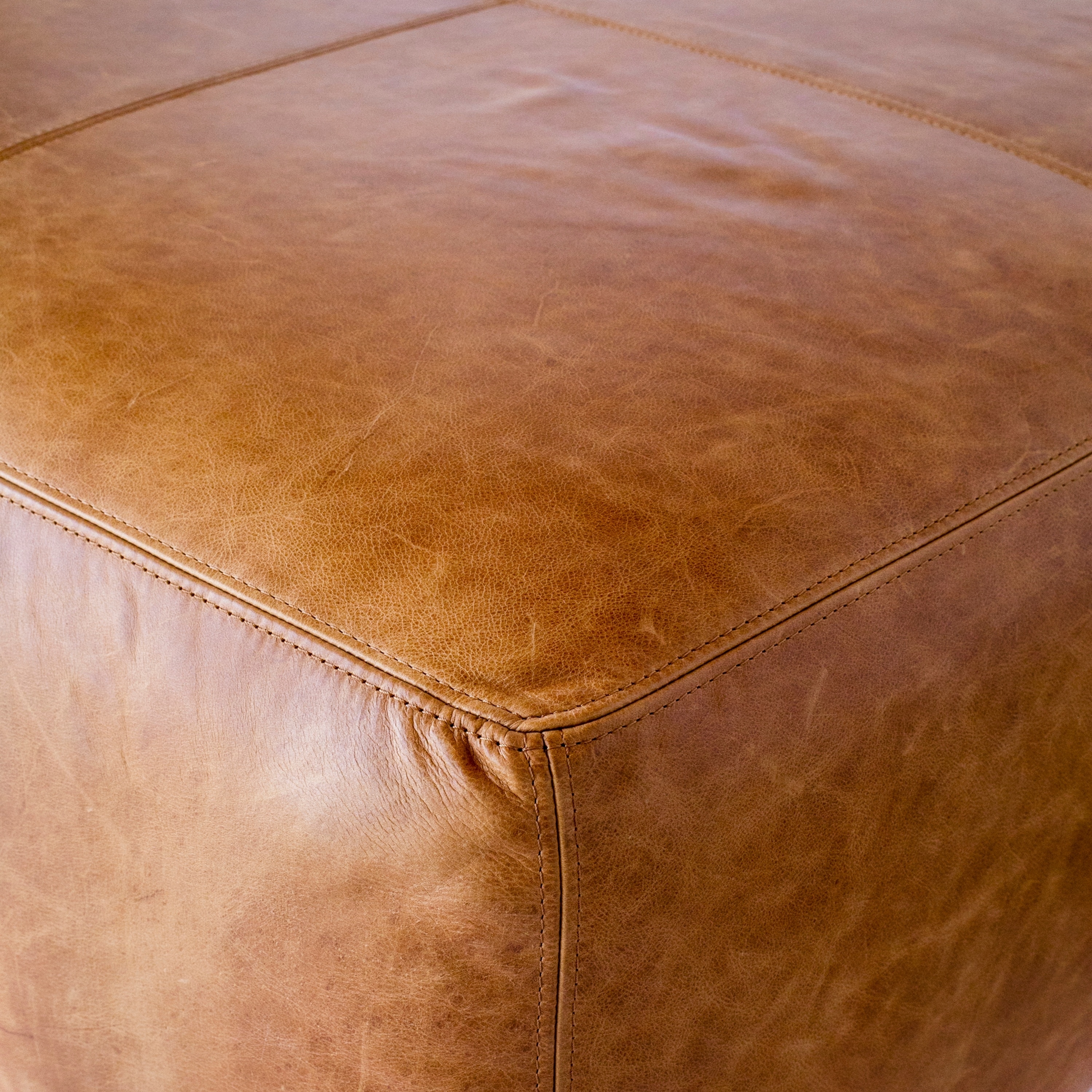 Strick & bolton sequoia on sale ottoman in cognac tan