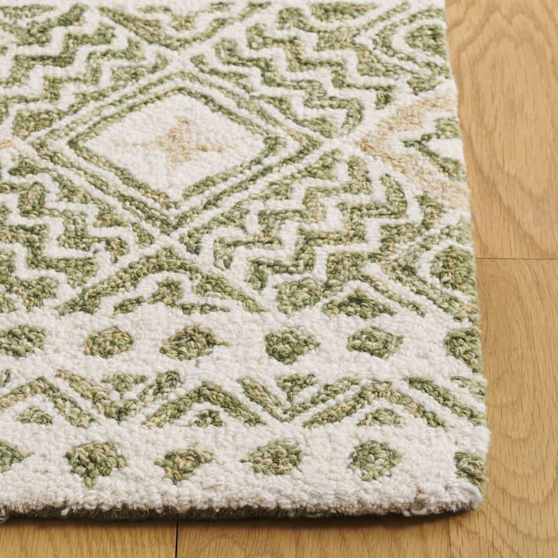 SAFAVIEH Handmade Micro-Loop Jelske Wool Rug
