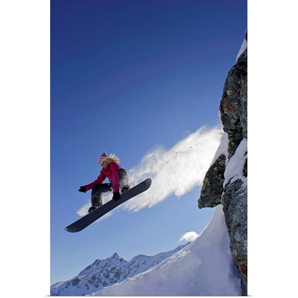 "Female snowboarder jumping off a rock" Poster Print