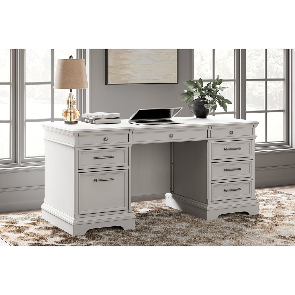 The Kanwyn Whitewash Partners Desk With 2 Bookcases is available at  Complete Suite Furniture, serving the Pacific Northwest.