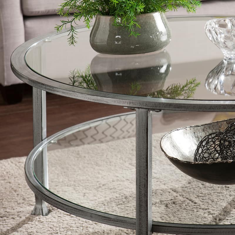 SEI Furniture Glenn Distressed Silver Round Coffee Table with Glass Top and Shelf