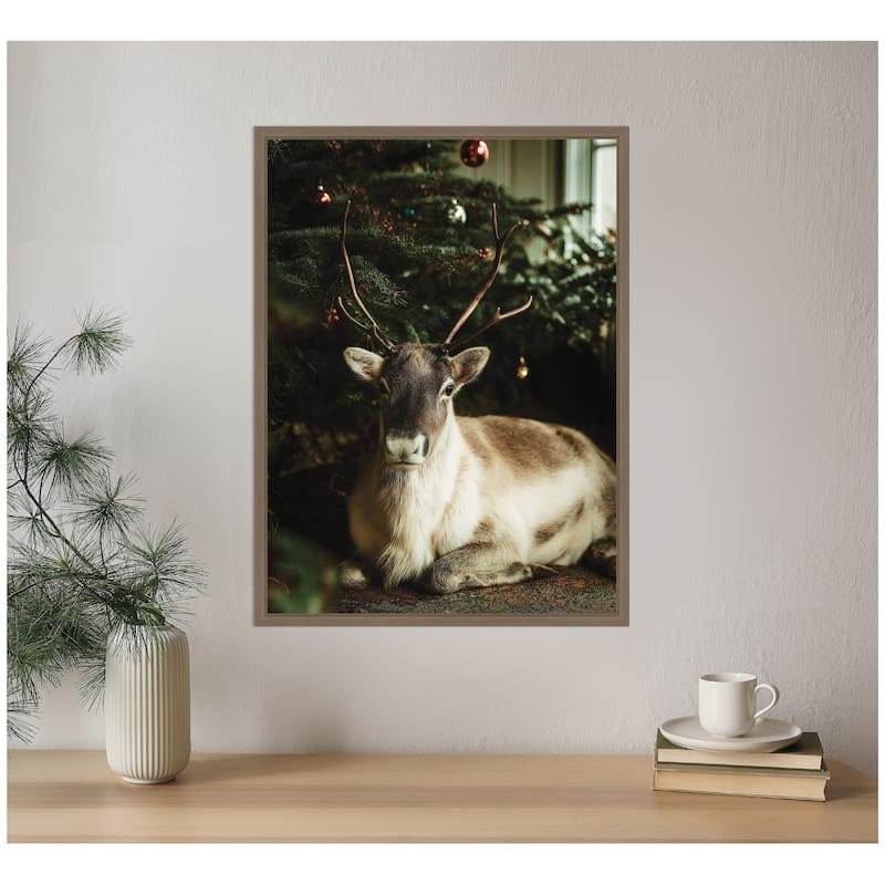 Kate and Laurel Sylvie Framed Canvas Reindeer Sitting Under a Christmas Tree by Michael Schauer
