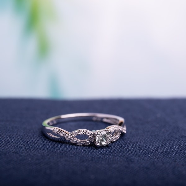 Miadora Sterling Silver Created White Sapphire and 1/10ct TDW Diamond Infinity Promise Ring. Opens flyout.