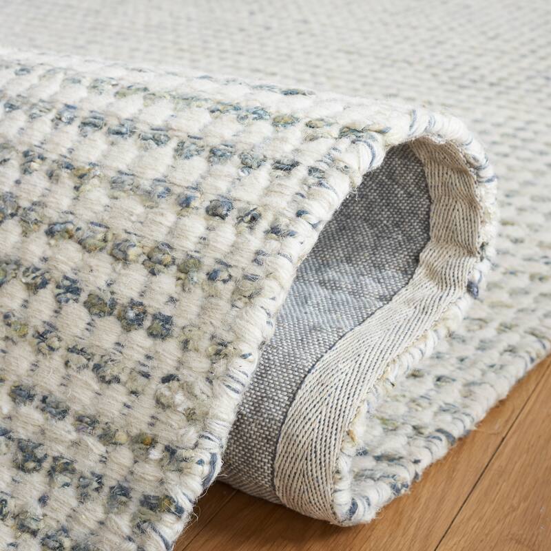 SAFAVIEH Handmade Casablanca Shag Ritsuko Wool Tassel Rug