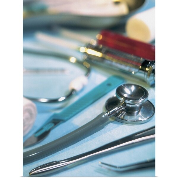 "close-up of a stethoscope kept with surgical tools" Poster Print
