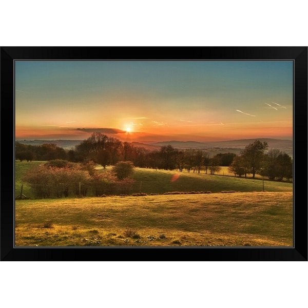 "Trees in line against fence at sunset in Broadway, Worcestershire." Black Framed Print