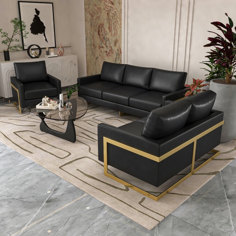 A modern living room set with multiple black leather seating pieces and gold metal frames arranged on a rug, creating a sectional setup.