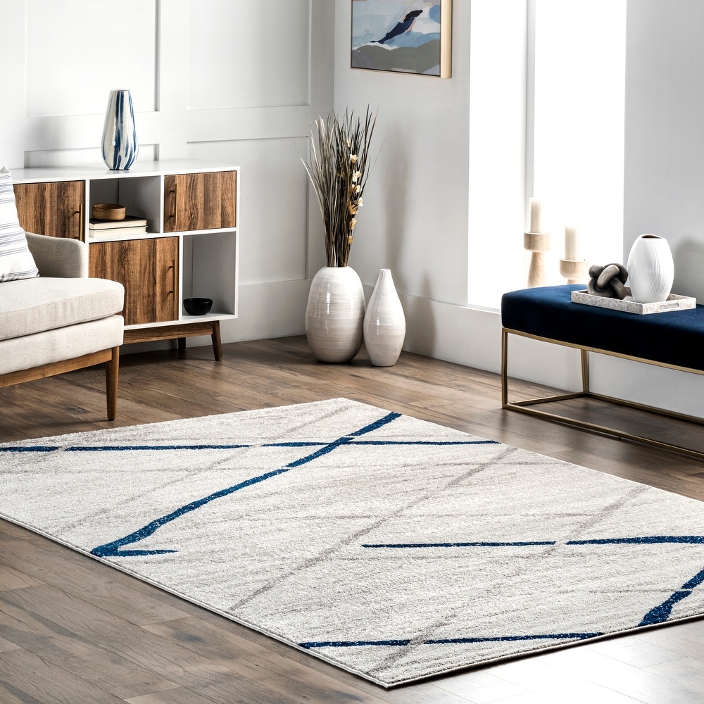 https://ak1.ostkcdn.com/images/products/is/images/direct/06eca9a2924659af9b28bf866f9f0e7473bde523/Brooklyn-Rug-Co-Skylar-Modern-Abstract-Area-Rug.jpg