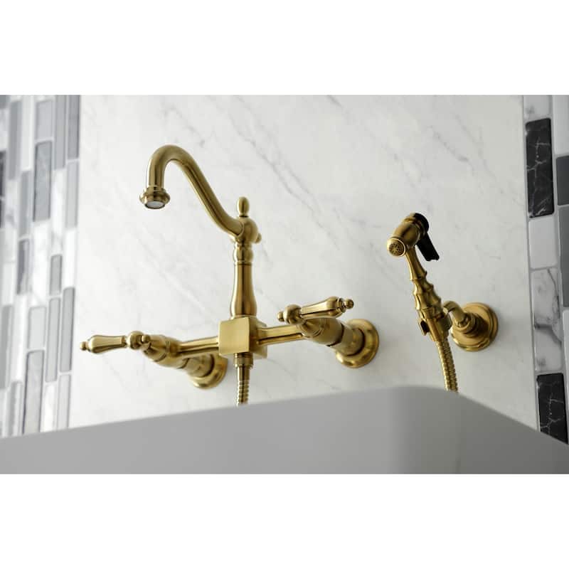 Kingston Brass Heritage Wall Mount Bridge Kitchen Faucet with Brass Sprayer - Brushed Brass