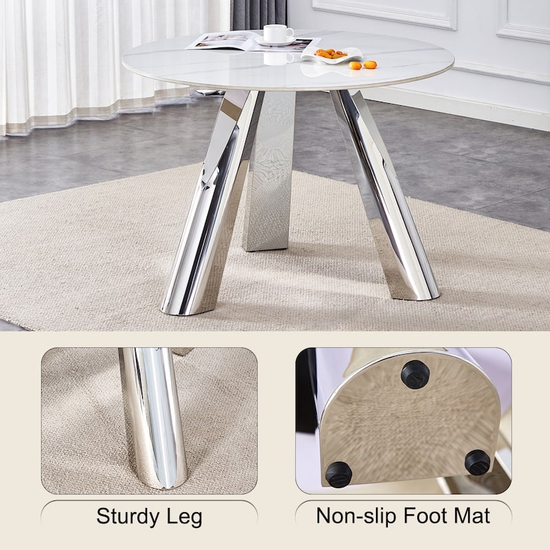 A 42-Inch Round Table with Stainless Steel Legs and a Marble Top, Perfect for 4 to 6 People.