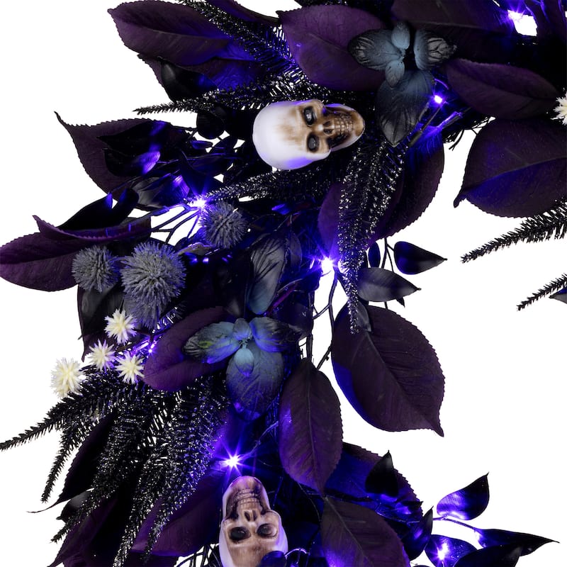 National Tree Company 26" Artificial Floral Mini Skull Wreath, 30 Purple LED Lights, Battery Operated - 26 in
