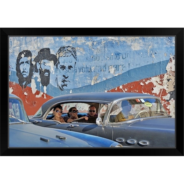 "People in vintage American cars and murals of the Cuban Revolution" Black Framed Print