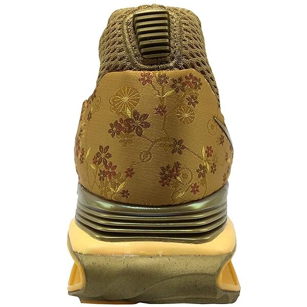 nike shox gravity women's gold