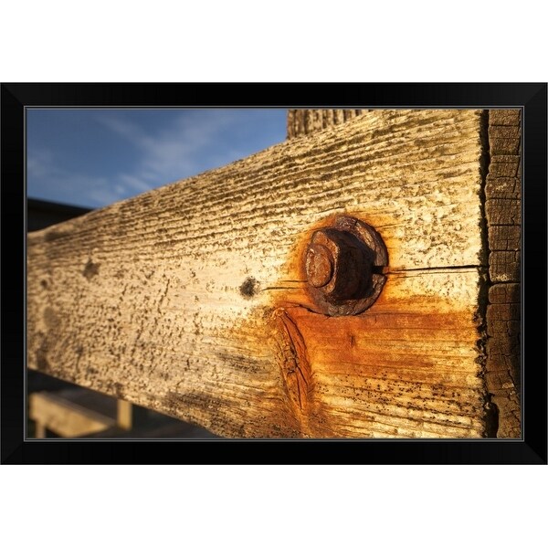 "Nut and bolt on a weathered wood wall" Black Framed Print