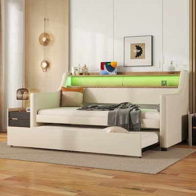 Twin Size PU Leather Upholstered Daybed with Trundle，Charging Station and LED Lights