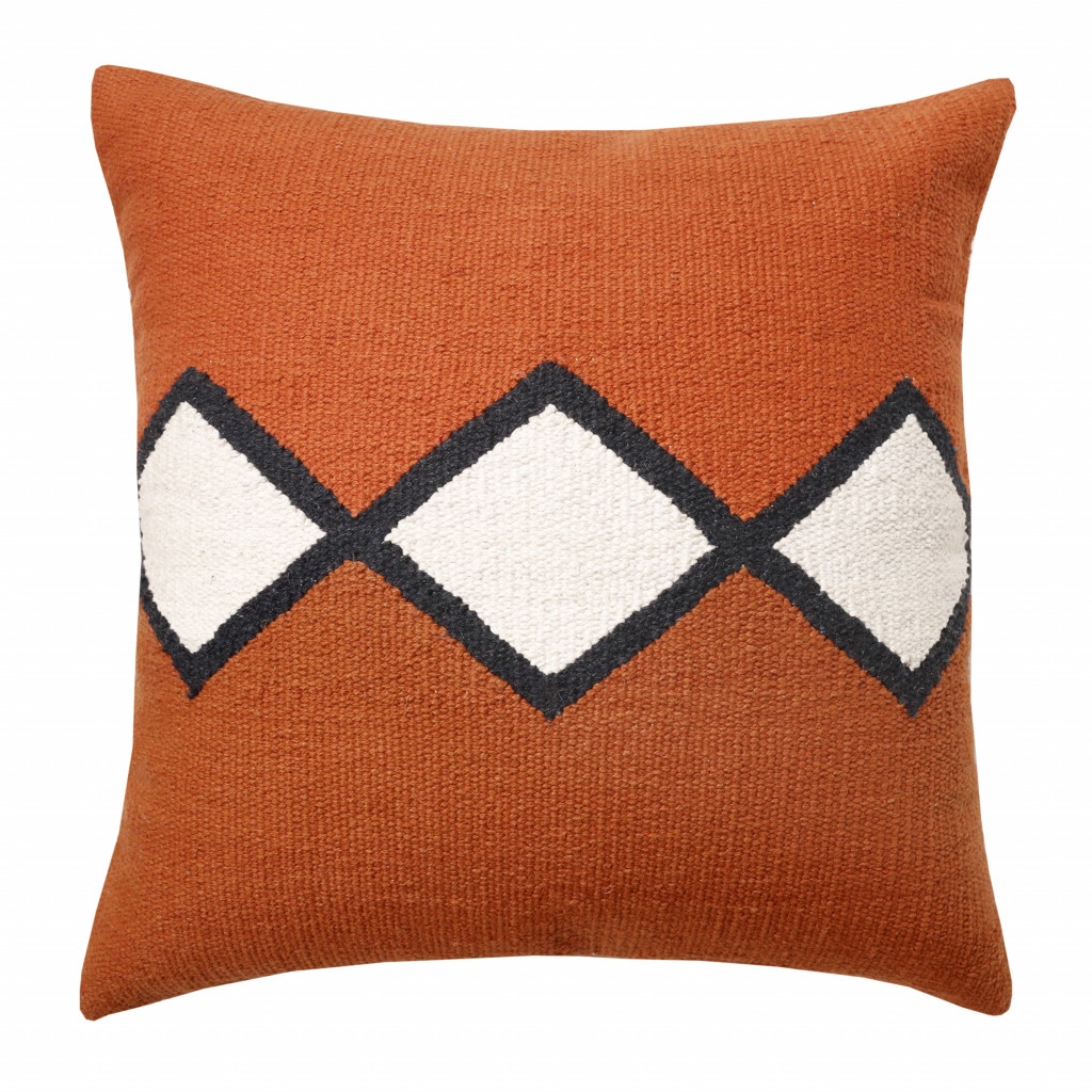 Orange and white throw pillows top