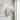 Acroma 1-Light Modern Glam Wall Sconce with Textured Glass Shade