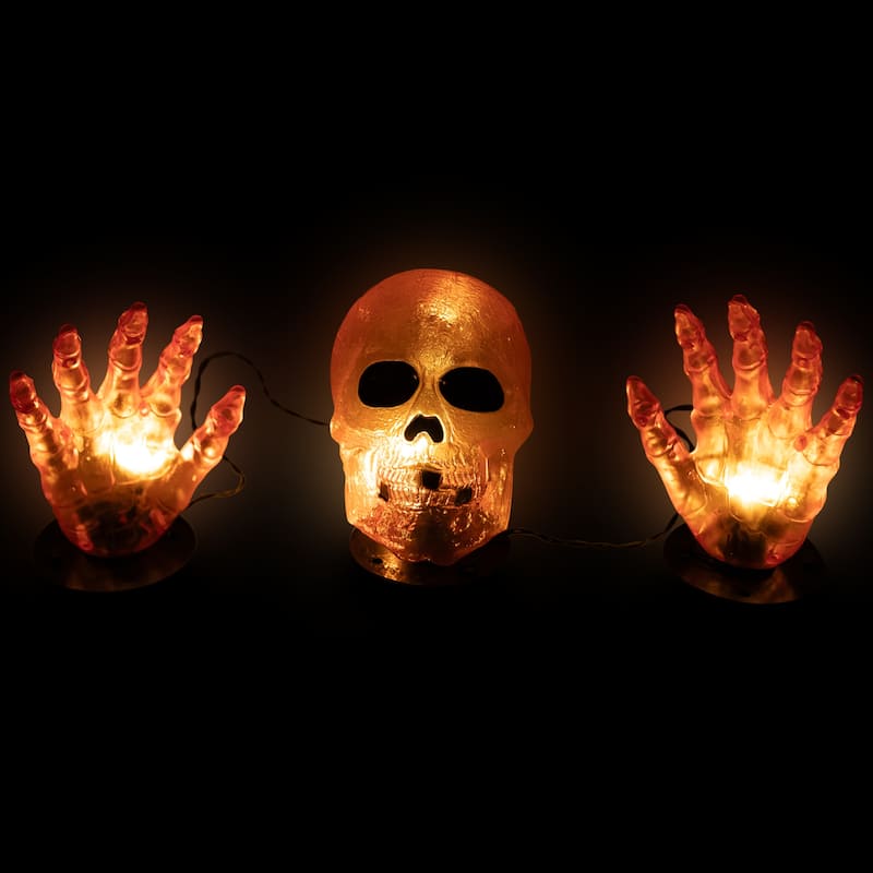 8.5" Lighted Orange Skull and Hands Outdoor Halloween Decoration - 4ft Black Wire