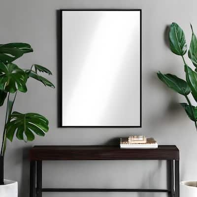 HomeRoots 38" Black Plastic Framed Accent Mirror - 26" W x 1.6" D x 38" H