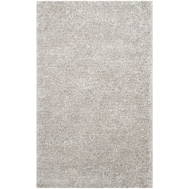 SAFAVIEH Handmade South Beach Leonella Shag Solid Polyester Rug