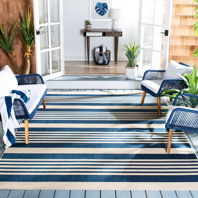 SAFAVIEH Courtyard Charmaine Indoor/ Outdoor Waterproof Area Rug - 6'7" x 9'6" - Navy/Beige