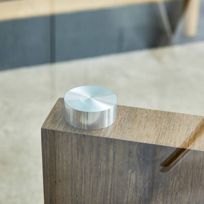 A rectangular modern and fashionable coffee table with tempered glass tabletop and black MDF legs