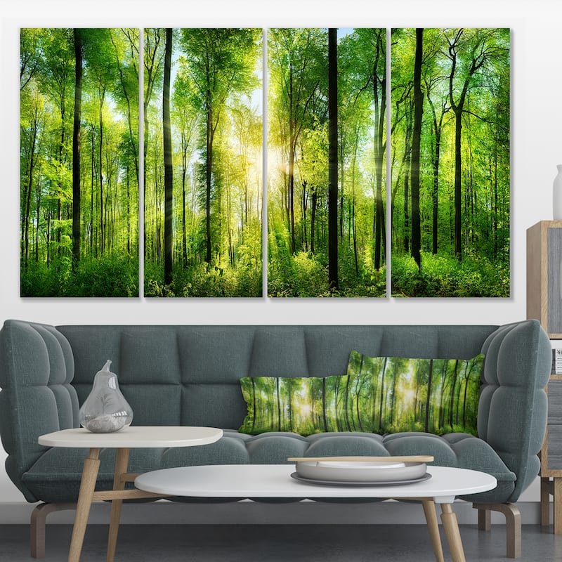 Designart "Forest with Rays of Sun Panorama" Landscape Canvas Print - 48 in. wide x 28 in. high - 4 Panels