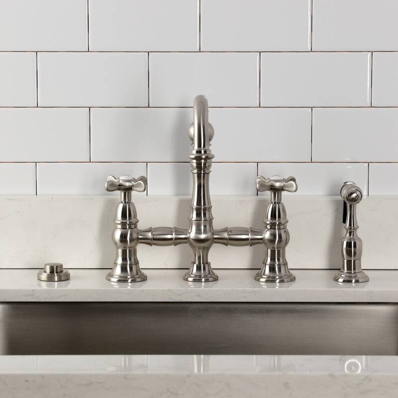 Kingston Brass Essex Two-Handle 4-Hole Deck Mount Bridge Kitchen Faucet with Brass Side Sprayer