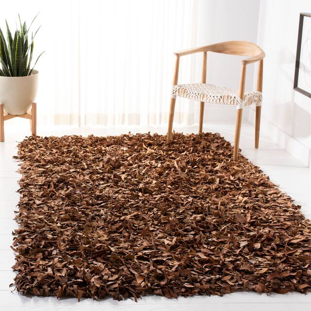 SAFAVIEH Handmade Leather Shag Carlijn Modern Decorative Rug - 6' x 9' - Brown
