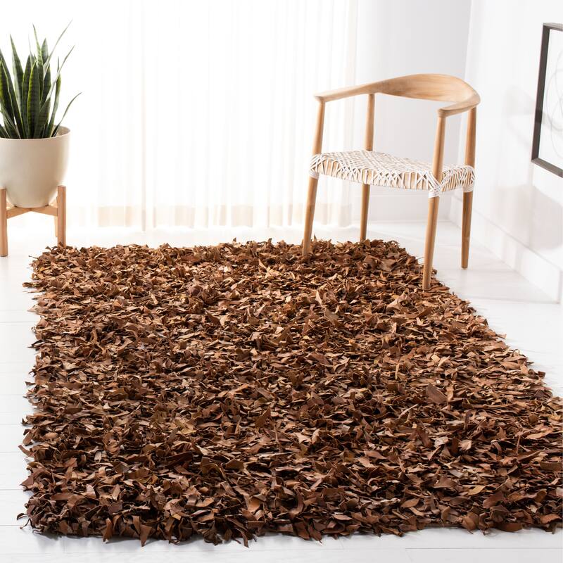 SAFAVIEH Handmade Leather Shag Carlijn Modern Decorative Rug - 6' x 9' - Brown