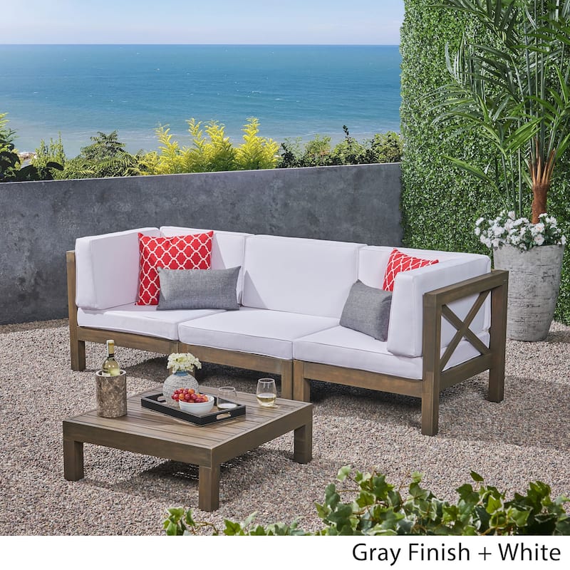 Brava Outdoor 3-Seater Acacia Wood Sectional Sofa Set with Coffee Table and Cushions by Christopher Knight Home
